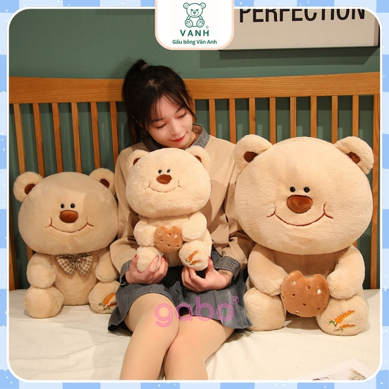 Xưởng sản xuất kinh doanh thú bông quà tặng Quảng Châu cao cấp Gấu Bông Gấu Mặt Cười Cầm Bánh - Gấu Đeo Nơ