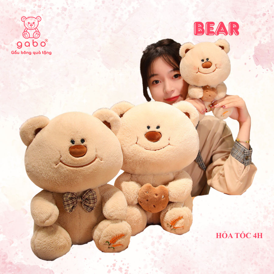 Gấu bông quà tặng gấu bông nhà làm gabo gấu bông q Gấu Bông Gấu Mặt Cười Cầm Bánh - Gấu Đeo Nơ
