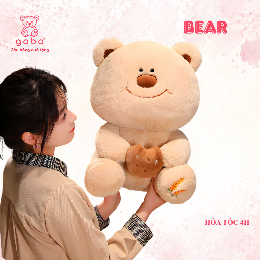 Gấu bông quà tặng gấu bông nhà làm gabo gấu bông q Gấu Bông Gấu Mặt Cười Cầm Bánh - Gấu Đeo Nơ
