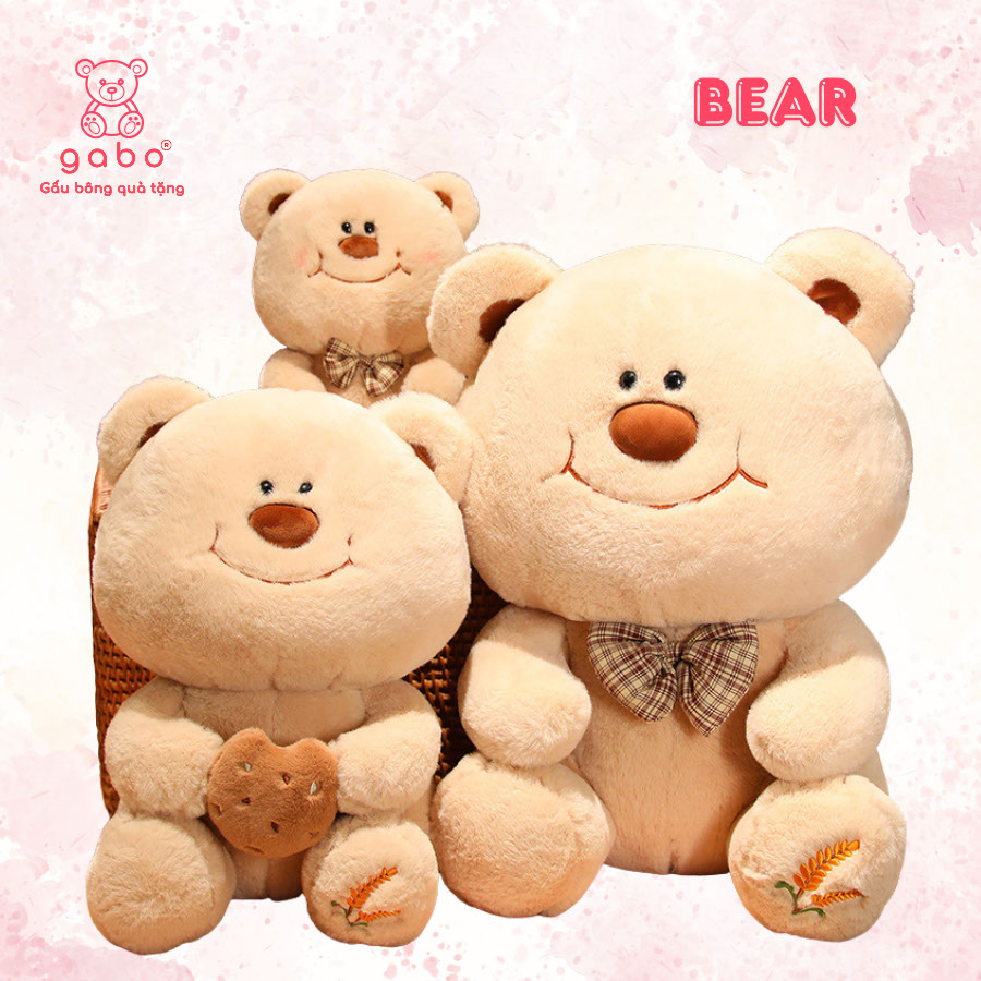 Gấu bông quà tặng gấu bông nhà làm gabo gấu bông q Gấu Bông Gấu Mặt Cười Cầm Bánh - Gấu Đeo Nơ